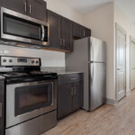 Spacious kitchen with stainless steel appliances and granite countertops